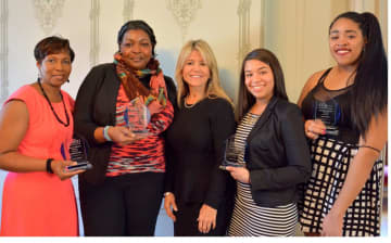 Students from The College of New Rochelle who received Ursuline Service Awards (left to right) Sheryl Clarke SNR’16; Andrea Fobbs SNR’13 GS’15; Judith Huntington, President of The College of New Rochelle; Catherine Pena SN’16; and Jade Sailor SAS’18.