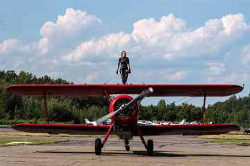 A wing-walker is shown at the 2015 Greenwood Lake Air Show.