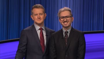 Syosset High School teacher Dan Wohl (right), pictured with host Ken Jennings, appeared on two episodes of Jeopardy!