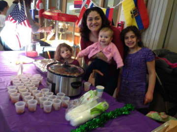 Anna Salerno with her daughters Bella, Amelia and Alexandra at her school's International Night Food Fair with hundreds of meatballs.