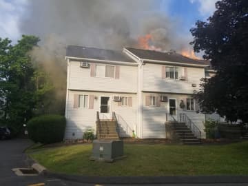 Two residents suffered from smoke inhalation during a three-alarm fire.