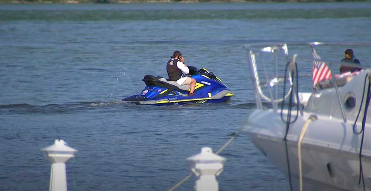 A jet ski rider was killed and another is critical after crashing head-on with another watercraft.